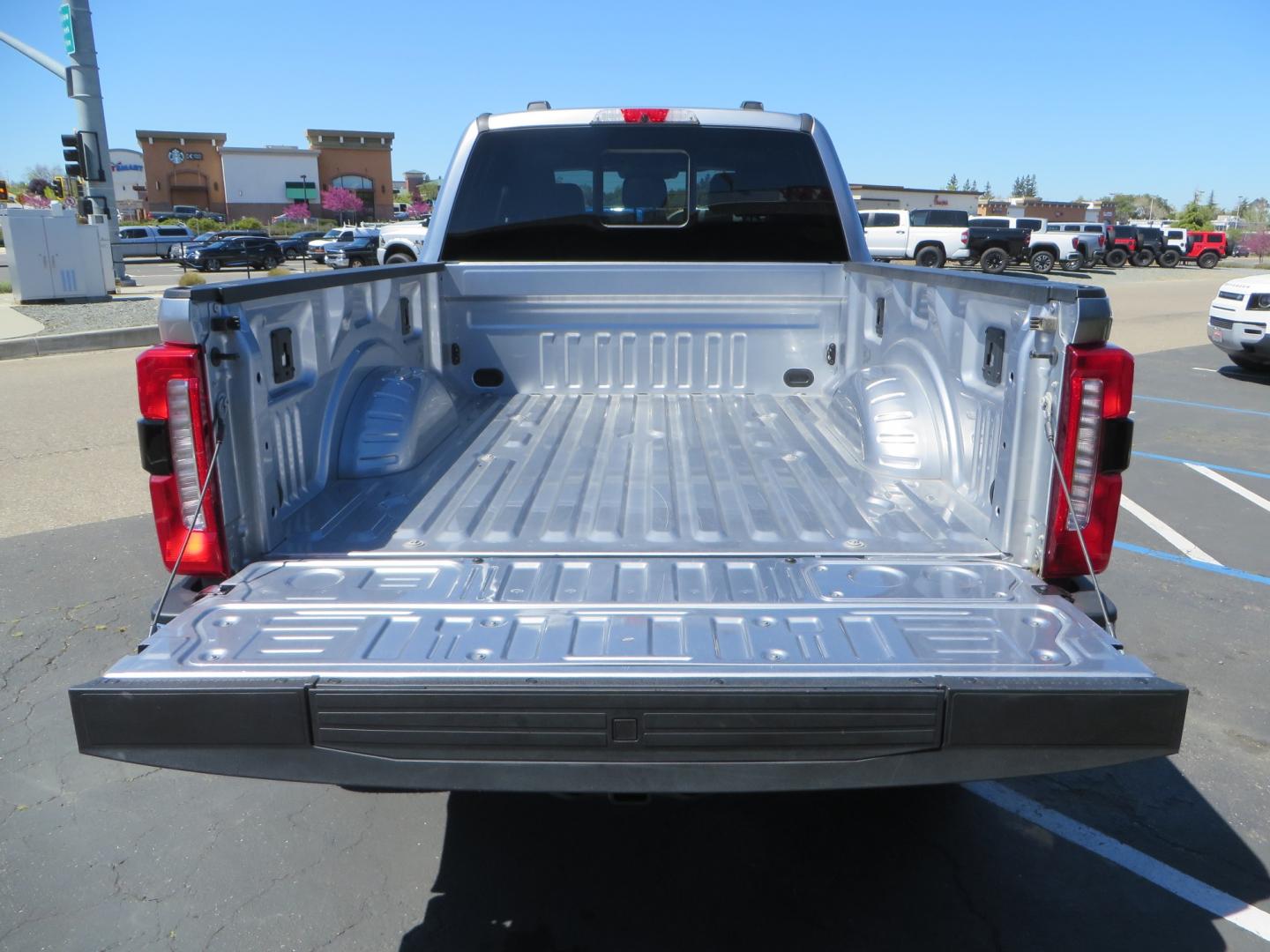 2023 SILVER /BLACK Ford F-350 SD Lariat Crew Cab 4WD (1FT8W3BT2PE) with an 6.7L V8 DIESEL engine, 10 speed automatic transmission, located at 2630 Grass Valley Highway, Auburn, CA, 95603, (530) 508-5100, 38.937893, -121.095482 - Features a BDS 5" radius arm suspension system, Fox Shocks, 37" Nitto Ridge Grappler tires, 20" Fuel Clash wheels, and Camper tie downs. - Photo#12